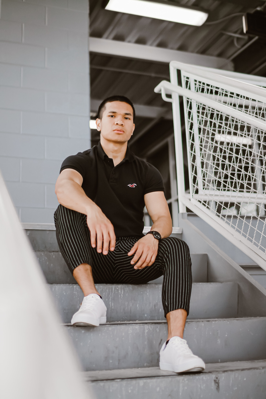 Young man resting on stairs