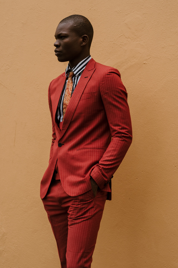 Male Model Posing in Red Suit